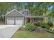Charming two-story home with a well-manicured lawn and inviting front porch at 110 Windsor Chase Dr, Lawrenceville, GA 30043