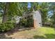 Charming two-story home with gray siding, brick accents, covered porch, and well-manicured landscaping at 110 Windsor Chase Dr, Lawrenceville, GA 30043
