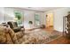 Cozy living room with hardwood floors, a patterned rug, and comfortable seating at 110 Windsor Chase Dr, Lawrenceville, GA 30043