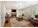 Spacious living room with fireplace, hardwood floors, neutral colored furniture and an area rug at 110 Windsor Chase Dr, Lawrenceville, GA 30043