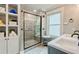 Modern bathroom with glass-enclosed shower and built in shelving at 5388 Silver Springs Dr, Sugar Hill, GA 30518