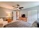 Cozy bedroom with a double bed, carpet flooring, and closet for storage at 5388 Silver Springs Dr, Sugar Hill, GA 30518