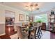 Elegant dining room with seating for six, stylish decor, and ample natural light at 5388 Silver Springs Dr, Sugar Hill, GA 30518