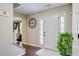 Welcoming foyer with hardwood floors, front door with sidelights, and classic accents at 5388 Silver Springs Dr, Sugar Hill, GA 30518