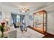 Inviting living room featuring stylish furniture, bay window, and elegant decor at 5388 Silver Springs Dr, Sugar Hill, GA 30518