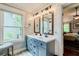 Updated primary bathroom with double vanity, new lighting and large mirrors at 5388 Silver Springs Dr, Sugar Hill, GA 30518