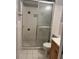 Bathroom featuring standing shower stall, toilet, and vanity with wood finish at 5540 Kingsport Ne Dr # 18, Atlanta, GA 30342