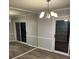 Bedroom area showcases a mirrored closet and access to outdoor space at 5540 Kingsport Ne Dr # 18, Atlanta, GA 30342