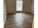 Bedroom featuring fresh paint, and contemporary flooring at 5540 Kingsport Ne Dr # 18, Atlanta, GA 30342