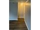 Freshly painted hallway featuring stylish wood flooring at 5540 Kingsport Ne Dr # 18, Atlanta, GA 30342