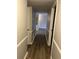 Clean and updated hallway offering an unobstructed view of the kitchen at 5540 Kingsport Ne Dr # 18, Atlanta, GA 30342