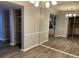 Spacious living room boasts a storage area, and seamless access to the kitchen at 5540 Kingsport Ne Dr # 18, Atlanta, GA 30342