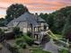 Aerial view of a beautiful home with a private in-ground pool and well-manicured landscaping at 219 Deer Park Trl, Canton, GA 30114