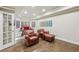 Cozy finished basement space featuring leather armchairs and recessed lighting, perfect for a relaxing entertainment area at 219 Deer Park Trl, Canton, GA 30114