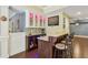 Finished basement featuring a stylish bar with granite countertops and cabinet with multicolored LED accent lighting at 219 Deer Park Trl, Canton, GA 30114