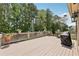 Wooden deck overlooking the treeline and a view of the pool at 219 Deer Park Trl, Canton, GA 30114