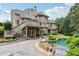 Exterior of home with a pool, a deck with stairs, and stone lion statues at 219 Deer Park Trl, Canton, GA 30114