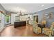 Open kitchen with a dark island, stainless steel appliances, and access to a breakfast nook, ideal for gatherings at 219 Deer Park Trl, Canton, GA 30114