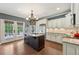 Bright kitchen featuring an island, stainless steel appliances, and a large window, creating a functional space at 219 Deer Park Trl, Canton, GA 30114