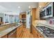 Gourmet kitchen with granite countertops, stainless steel appliances, and ample wood cabinetry at 219 Deer Park Trl, Canton, GA 30114