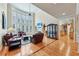 Bright living room featuring large windows, a vaulted ceiling, fireplace and hardwood floors at 219 Deer Park Trl, Canton, GA 30114