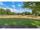Large playground with swings, slides, and benches surrounded by greenery at 219 Deer Park Trl, Canton, GA 30114