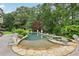 Backyard pool and spa area accented with elegant statues and lush greenery at 219 Deer Park Trl, Canton, GA 30114