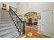 Spacious foyer features a staircase with iron railing and hardwood flooring at 219 Deer Park Trl, Canton, GA 30114