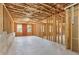 Unfinished basement features exposed framing, with insulation and windows, ready for customization at 266 Hanover Dr, Villa Rica, GA 30180