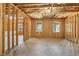 Unfinished basement reveals exposed wood framing and windows, presenting a blank canvas for customization at 266 Hanover Dr, Villa Rica, GA 30180