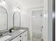 Bathroom with dual sinks and granite counters with access to an enclosed shower/tub combo at 266 Hanover Dr, Villa Rica, GA 30180