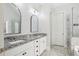 Stylish bathroom with double vanity, granite countertops, tile floor, glass shower, and separate bathtub at 266 Hanover Dr, Villa Rica, GA 30180