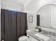 Stylish bathroom features a granite vanity, framed mirror, and shower with curtain at 266 Hanover Dr, Villa Rica, GA 30180