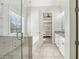 Bathroom featuring a soaking tub, glass shower, double vanity with granite countertop, and tile flooring at 266 Hanover Dr, Villa Rica, GA 30180