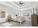 Bright bedroom with a tray ceiling, ceiling fan, with two windows at 266 Hanover Dr, Villa Rica, GA 30180