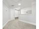Bright bonus room offers neutral color palette, carpet flooring, and adjacent room for flexible living at 266 Hanover Dr, Villa Rica, GA 30180
