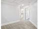 Bright bonus room features neutral color palette, carpet flooring, and entryways to other rooms at 266 Hanover Dr, Villa Rica, GA 30180