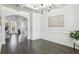 The dining room features beautiful hardwood floors, coffered ceilings, and elegant wainscoting, with a fireplace view at 266 Hanover Dr, Villa Rica, GA 30180
