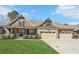 Charming home with a manicured lawn, inviting stone accents, and a spacious three-car garage at 266 Hanover Dr, Villa Rica, GA 30180