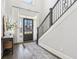 Bright foyer with dark wood floors, staircase, and a stylish front door creating a welcoming entrance at 266 Hanover Dr, Villa Rica, GA 30180