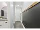 Hallway with a decorative wall and coat hooks leading to a bathroom at 266 Hanover Dr, Villa Rica, GA 30180
