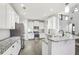 Bright and modern kitchen featuring granite counters and stainless steel appliances at 266 Hanover Dr, Villa Rica, GA 30180
