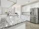 Beautiful kitchen with granite countertops, stainless steel refrigerator, and ample cabinet space at 266 Hanover Dr, Villa Rica, GA 30180