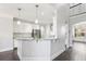 Bright kitchen featuring white cabinetry, granite countertops, stainless steel appliances, and hardwood floors at 266 Hanover Dr, Villa Rica, GA 30180
