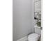 This powder room features a toilet and artwork at 266 Hanover Dr, Villa Rica, GA 30180