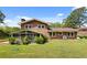 Spacious backyard featuring a screened-in porch, green lawn, and mature landscaping at 3082 Briarleaf Dr, Decatur, GA 30034