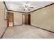 Bedroom features neutral carpeting and a view to the ensuite bathroom at 3082 Briarleaf Dr, Decatur, GA 30034
