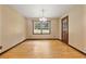 Charming dining room with wood floors and a view to the yard through large windows at 3082 Briarleaf Dr, Decatur, GA 30034