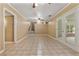 Open living room featuring tile floors, neutral walls, and doors to the screened-in porch at 3082 Briarleaf Dr, Decatur, GA 30034