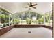 Covered sunroom with screened-in walls and brick foundation, great view of the backyard at 3082 Briarleaf Dr, Decatur, GA 30034